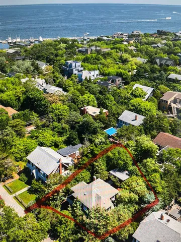 a kitchen with stainless steel appliances granite countertop a refrigerator a stove and a sink