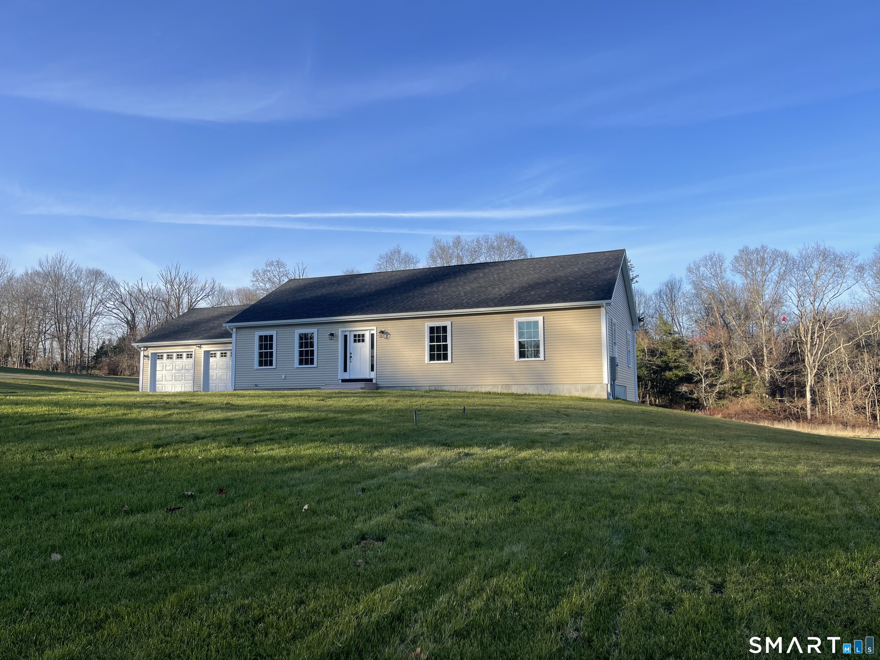 76 Wauregan Road Canterbury, CT 06331 - Photo 2 of 26 a house view with a garden space