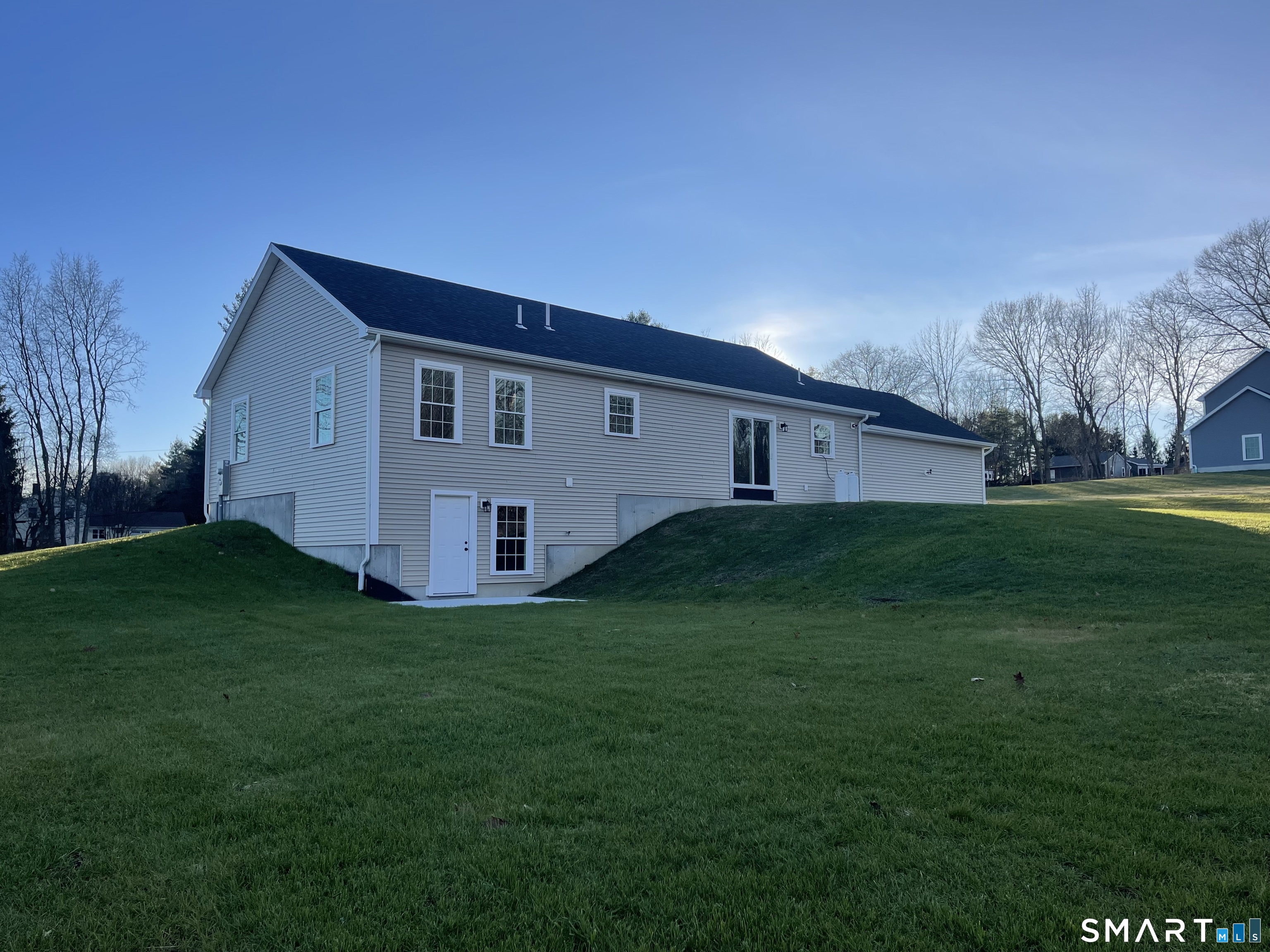 76 Wauregan Road Canterbury, CT 06331 - Photo 3 of 26 a view of a house with a big yard
