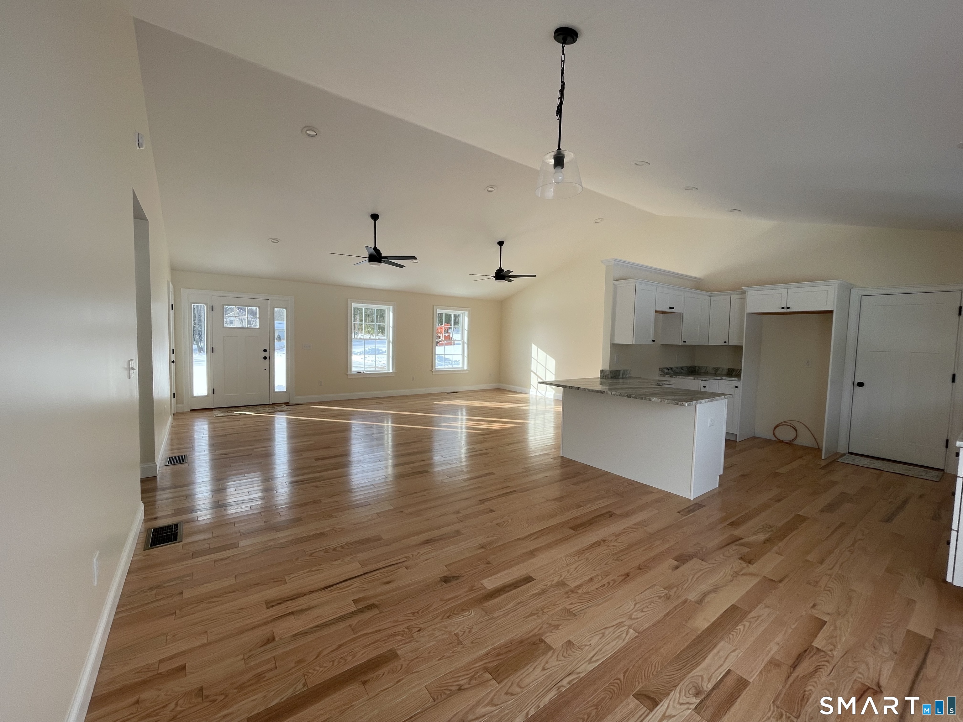 76 Wauregan Road Canterbury, CT 06331 - Photo 8 of 26 a view of a kitchen with kitchen island a sink stainless steel appliances and cabinets