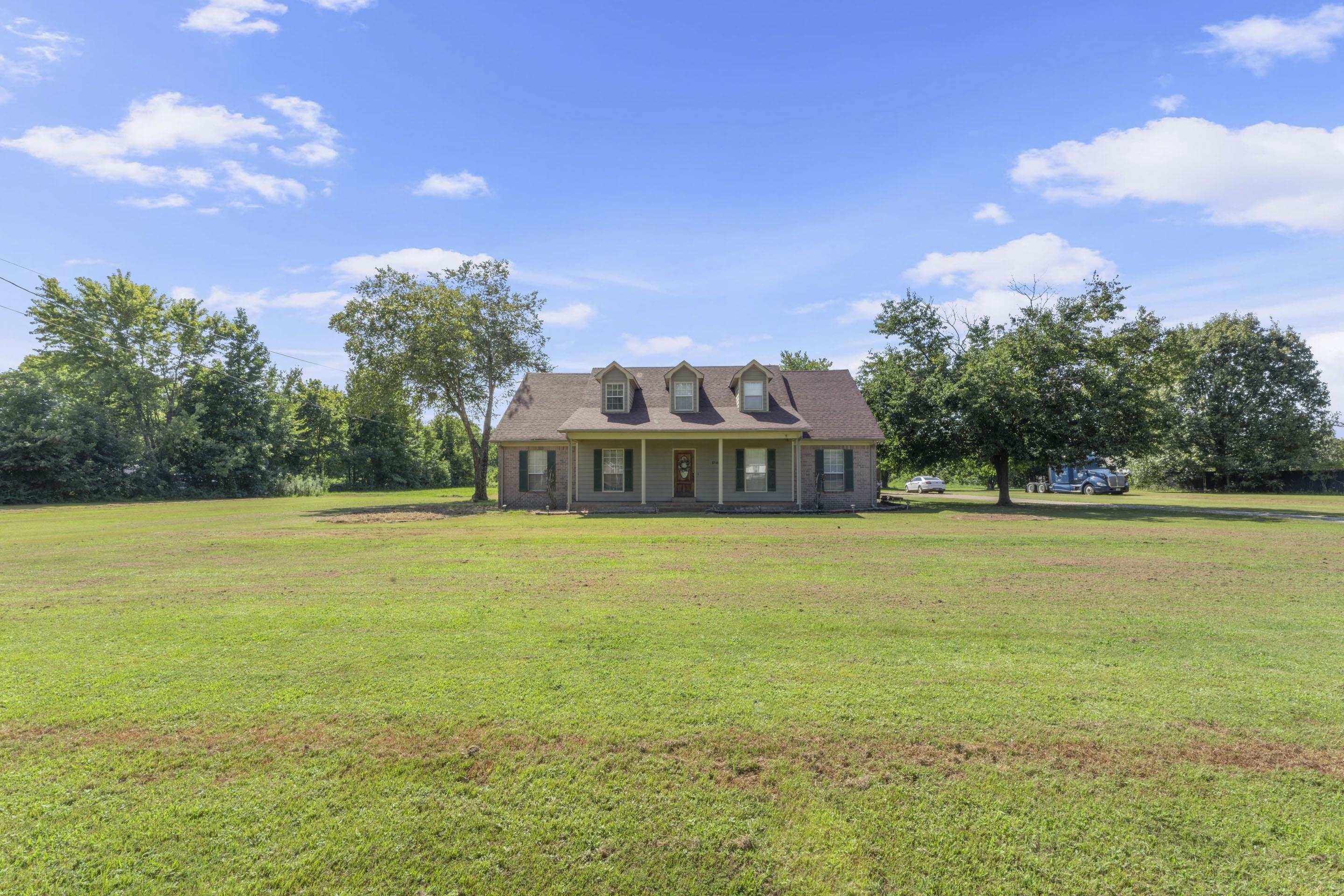 7265 Ward Road Millington, TN 38053 - Photo 1 of 29 New england style home with a porch and a front yard
