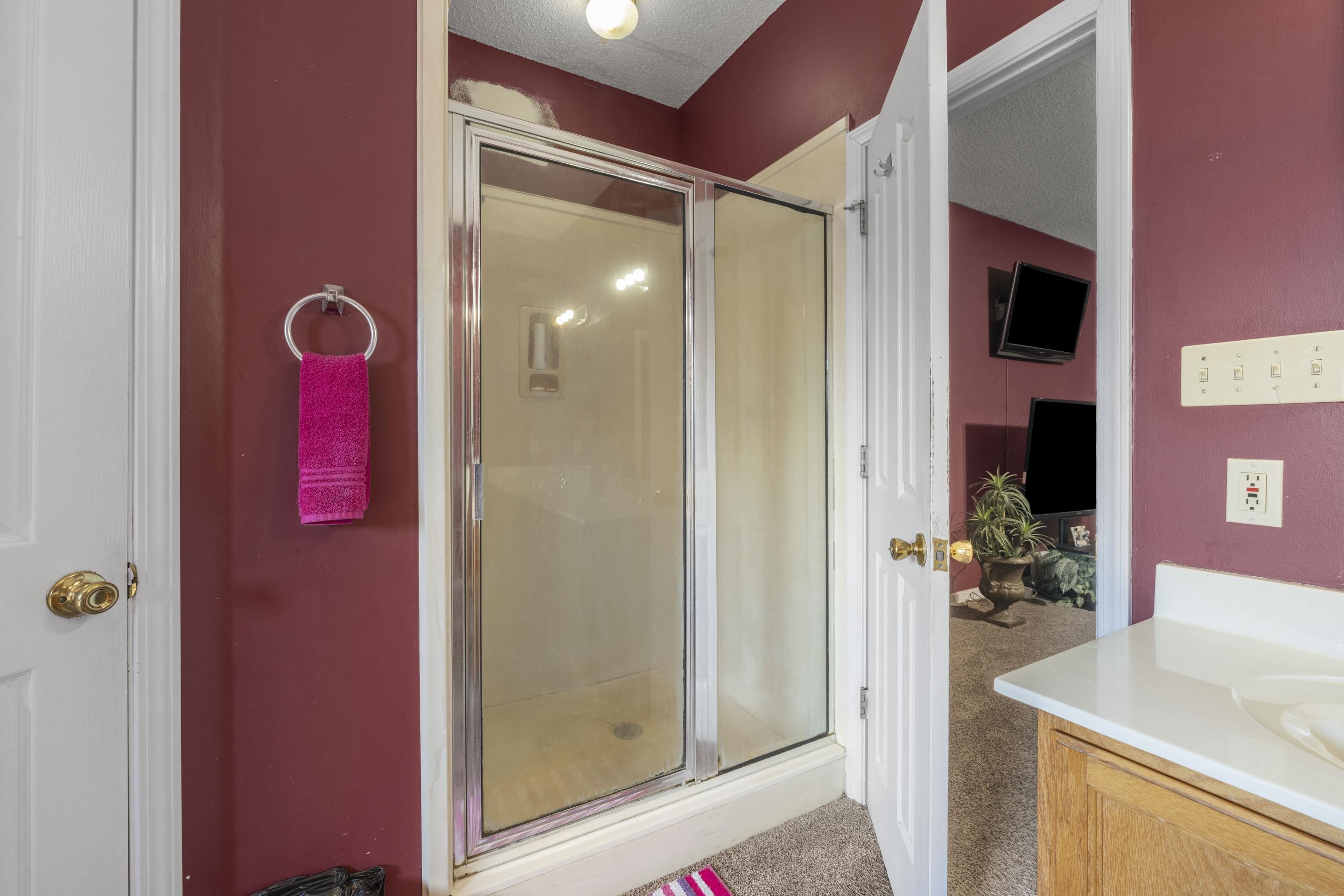 7265 Ward Road Millington, TN 38053 - Photo 14 of 29 Full bath with vanity, a textured ceiling, and a stall shower