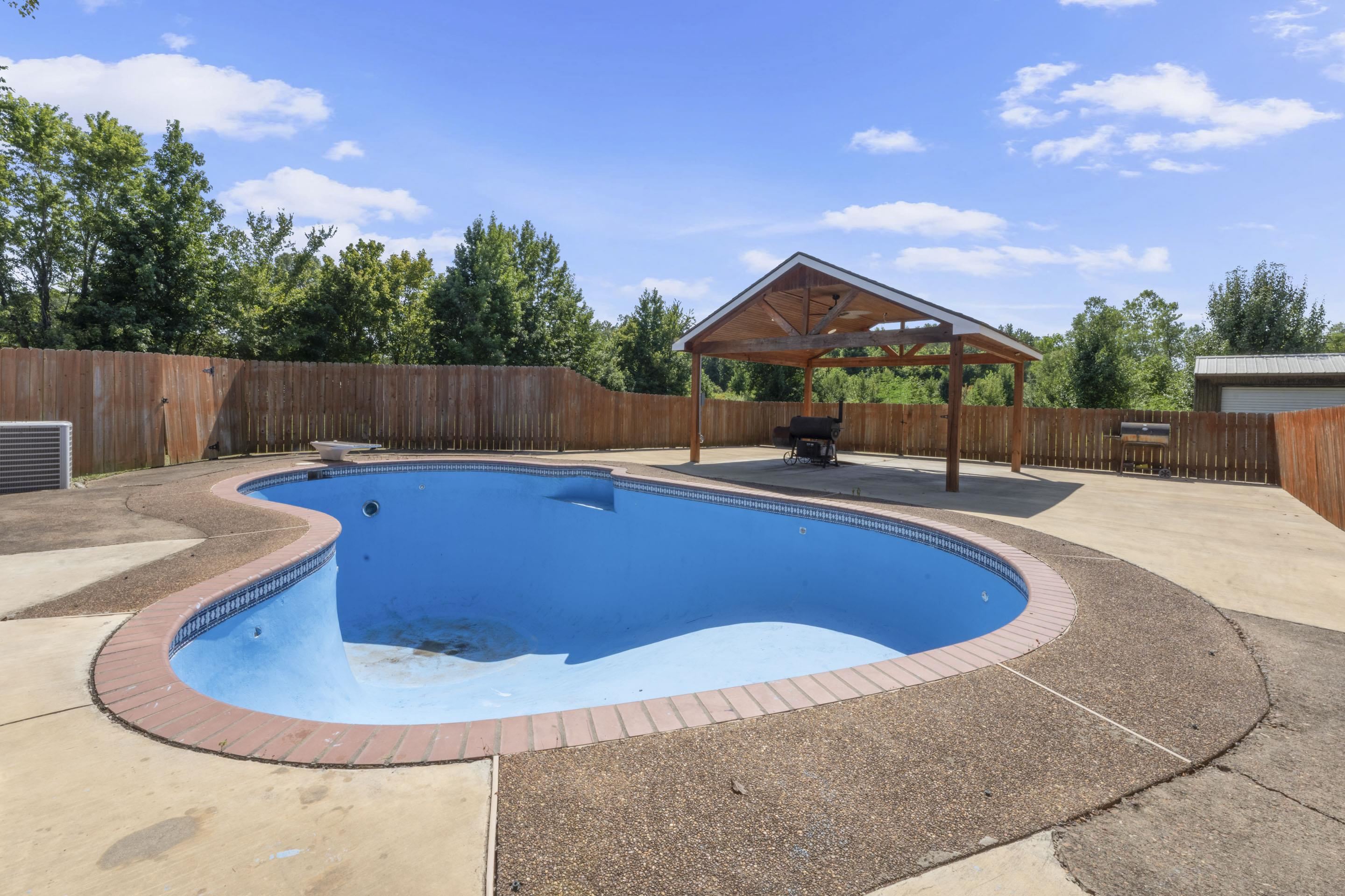 7265 Ward Road Millington, TN 38053 - Photo 25 of 29 View of swimming pool with a patio area, a fenced backyard, and a diving board
