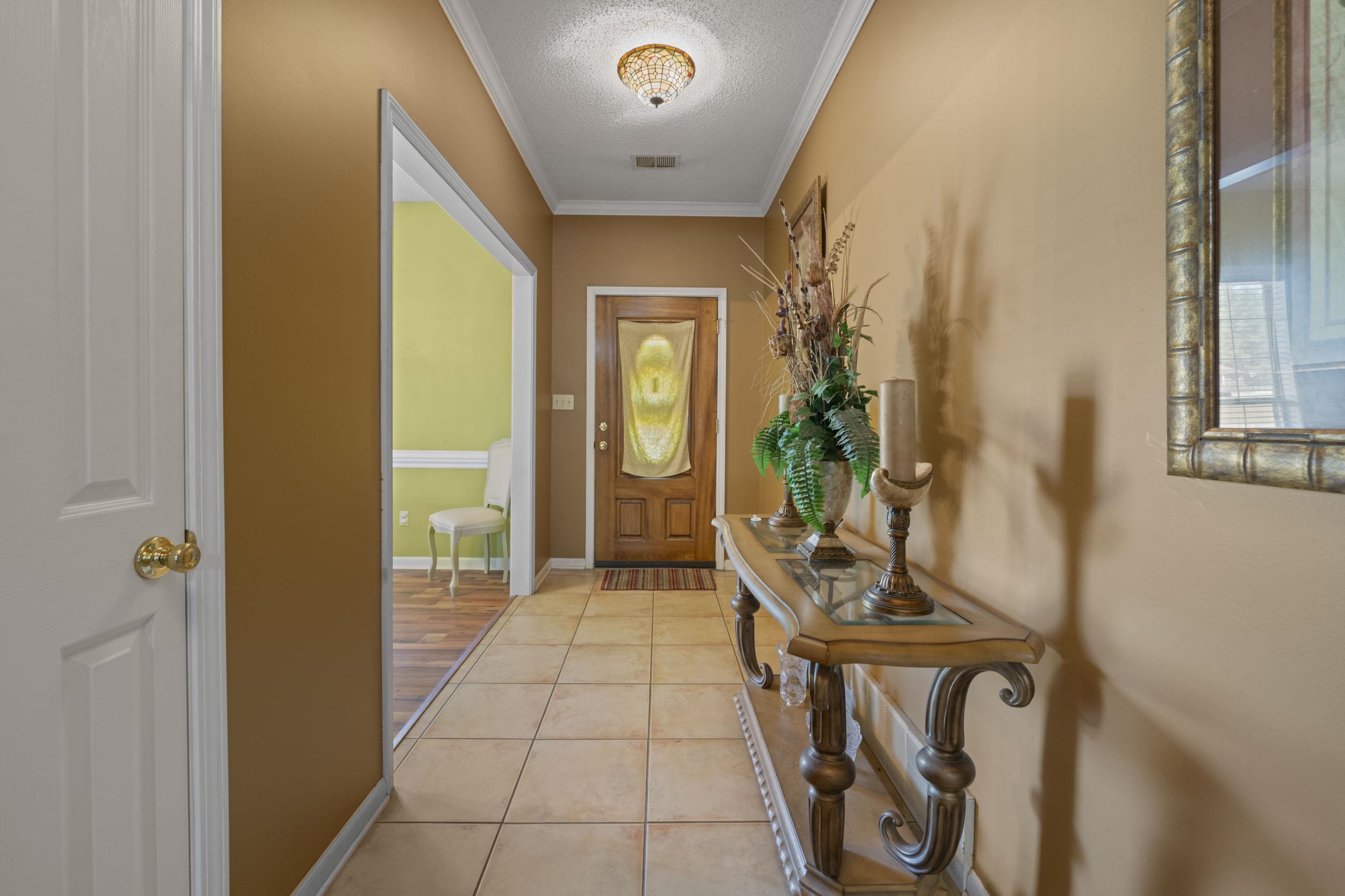 7265 Ward Road Millington, TN 38053 - Photo 4 of 29 Entryway with ornamental molding, tile patterned floors, and a textured ceiling