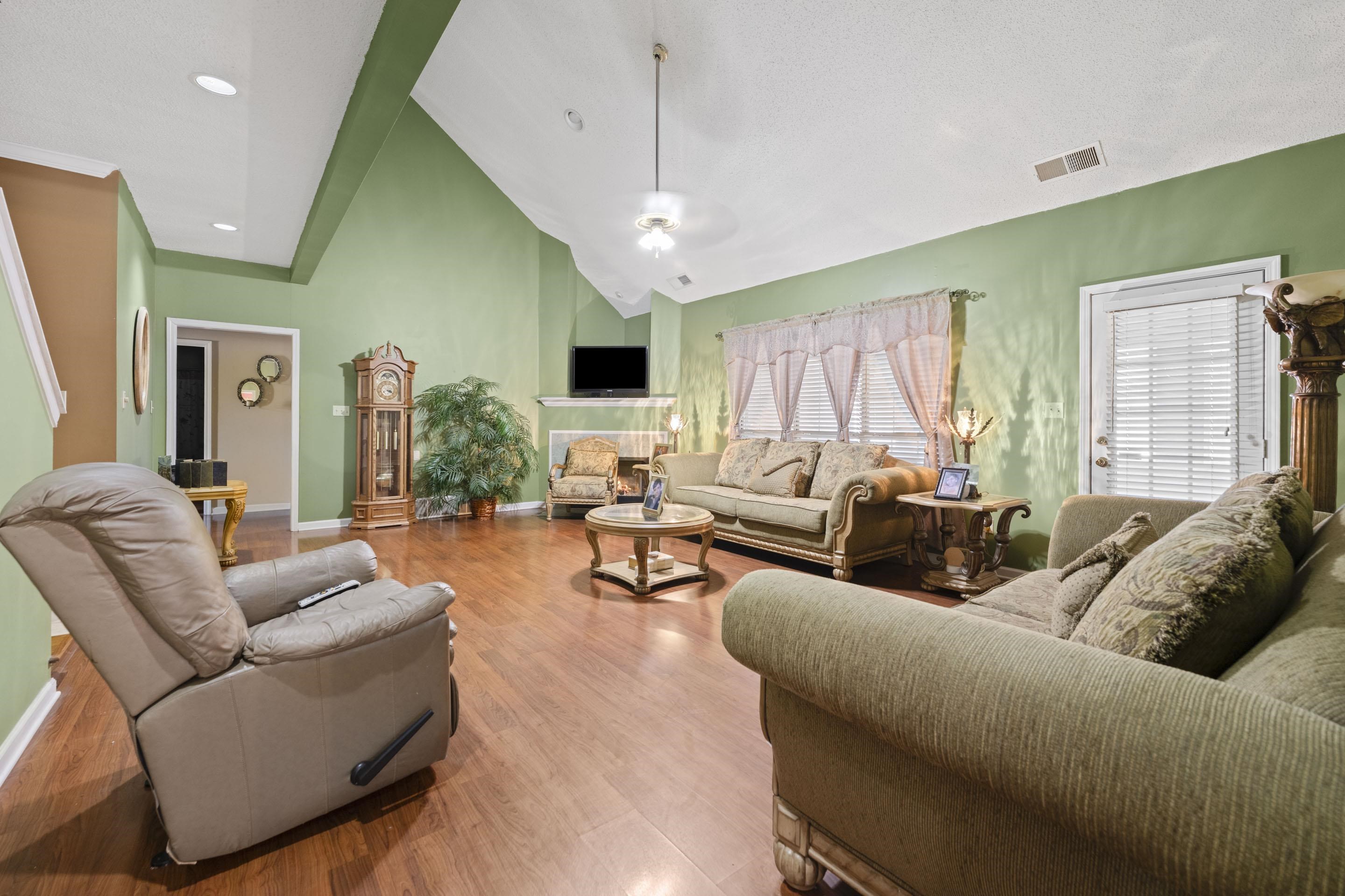 7265 Ward Road Millington, TN 38053 - Photo 5 of 29 Living area with high vaulted ceiling, wood finished floors, and a ceiling fan