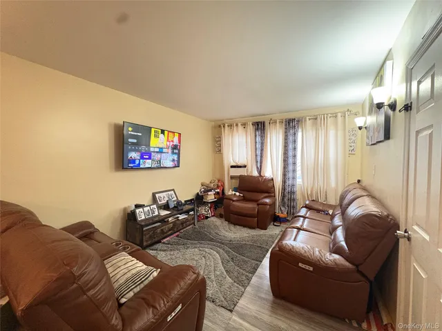 a bathroom with a sink a toilet and shower curtain