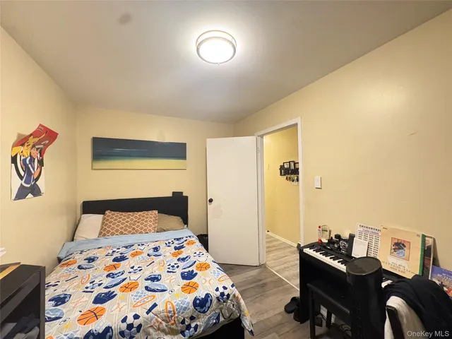 a bed room with a bed and a television