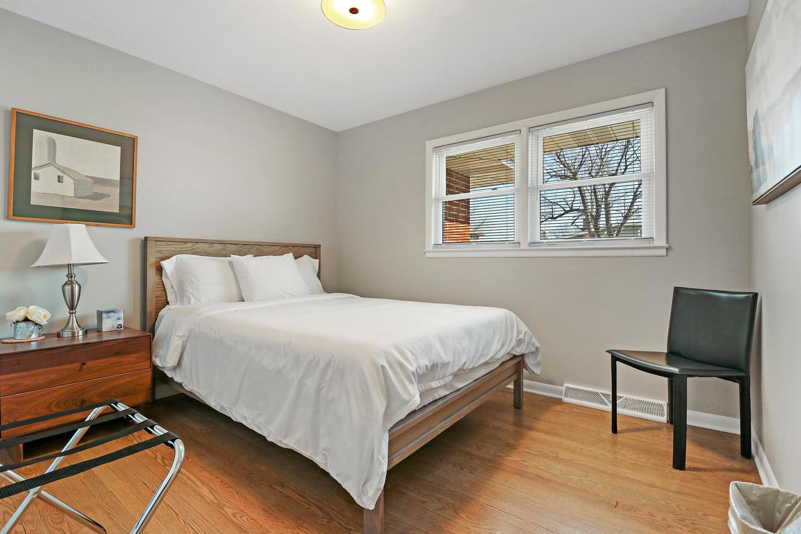 2532 North Jackson Street Waukegan, IL 60087 - Photo 17 of 29 a bedroom with a bed and wooden floor