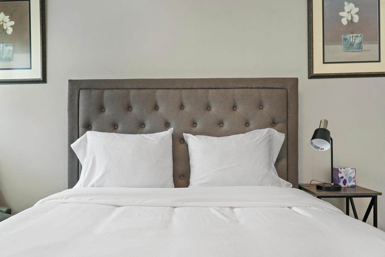 2532 North Jackson Street Waukegan, IL 60087 - Photo 20 of 29 a large bed sitting in a bedroom and painting on the wall