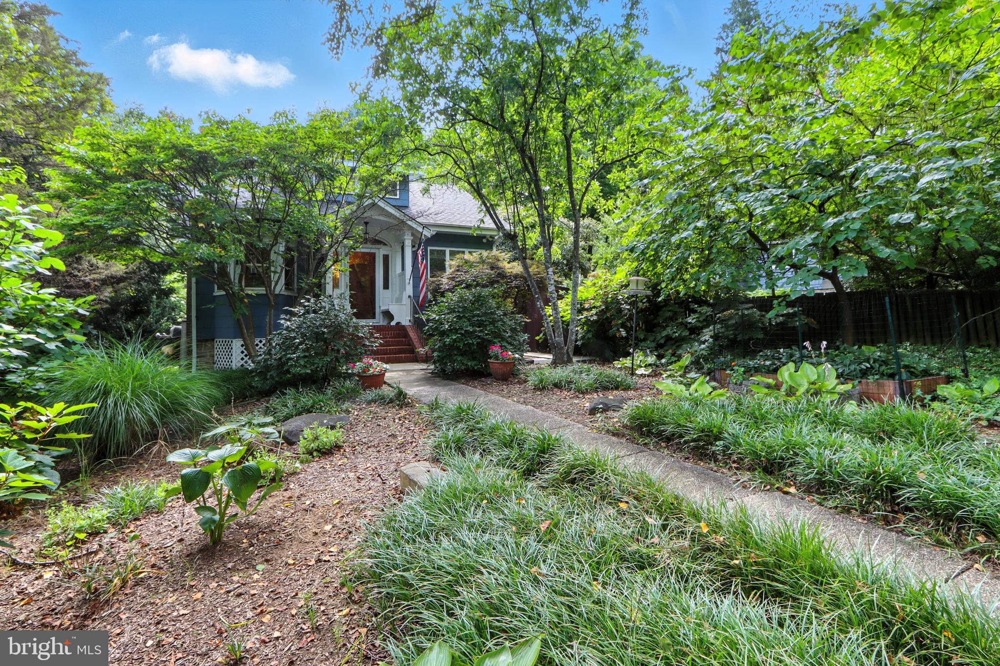 5721 Ridgedale Road Baltimore, MD 21209 - Photo 13 of 54 a front view of a house with a yard