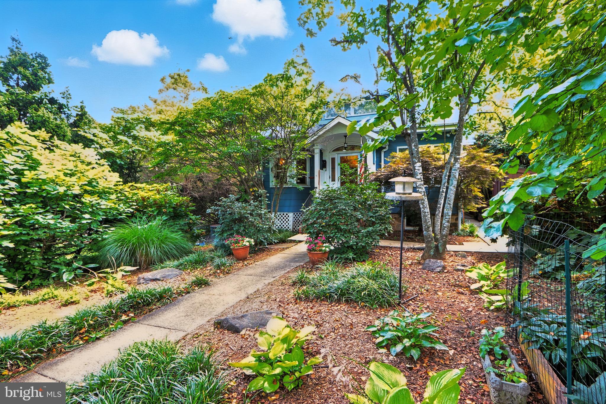 5721 Ridgedale Road Baltimore, MD 21209 - Photo 15 of 54 a front view of a house with a yard