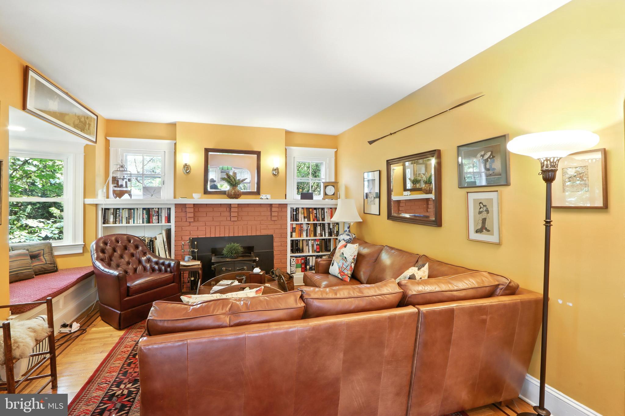 5721 Ridgedale Road Baltimore, MD 21209 - Photo 19 of 54 a living room with fireplace furniture and a large window