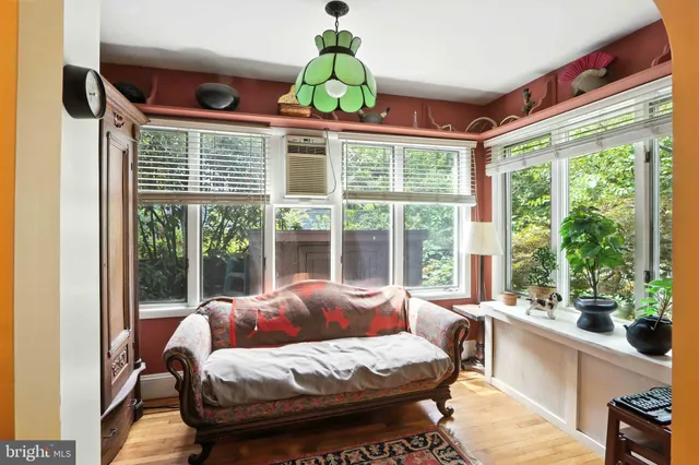 a kitchen with a stove a sink and a window