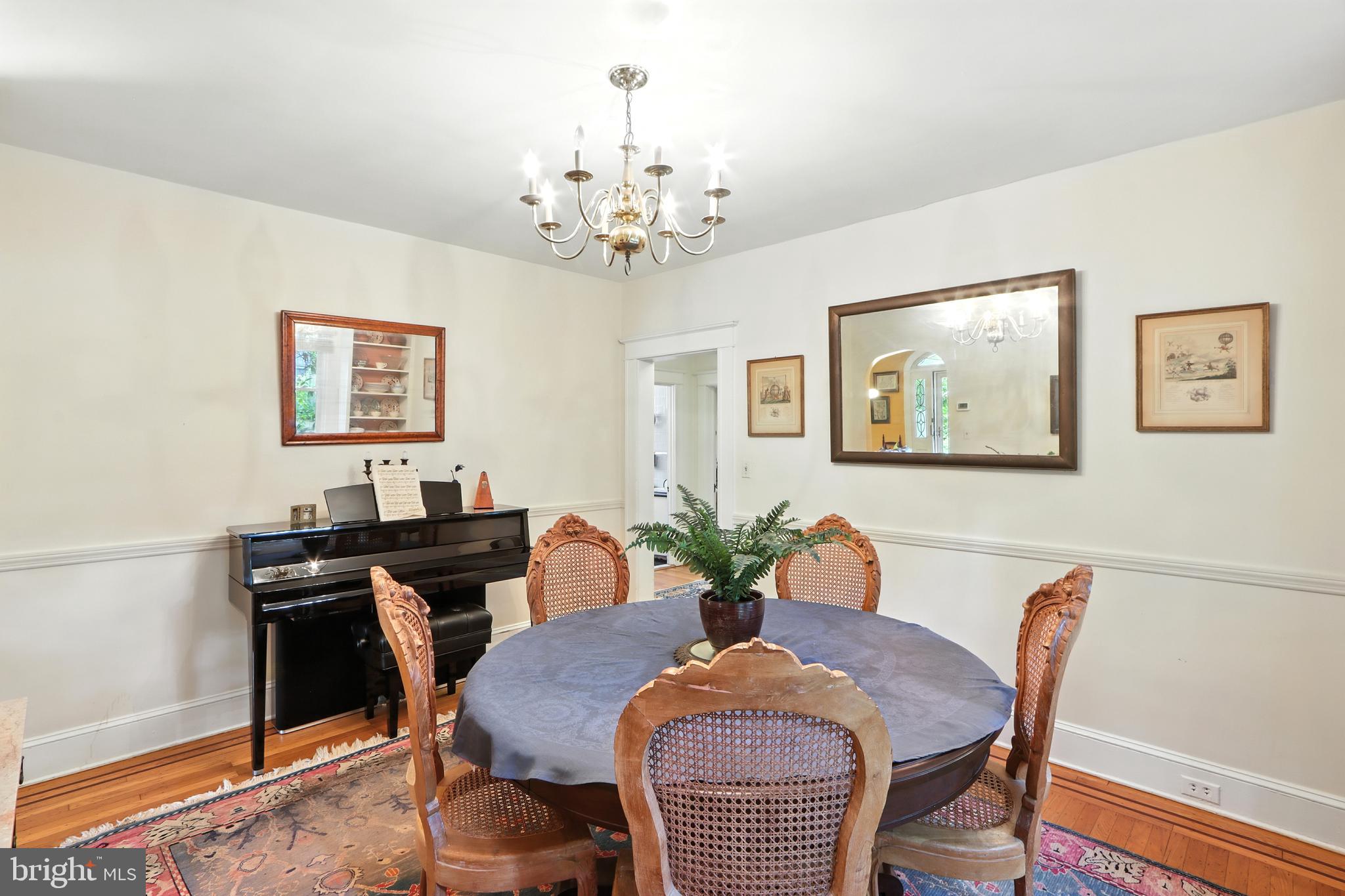 5721 Ridgedale Road Baltimore, MD 21209 - Photo 26 of 54 a view of a dining room with furniture and chandelier