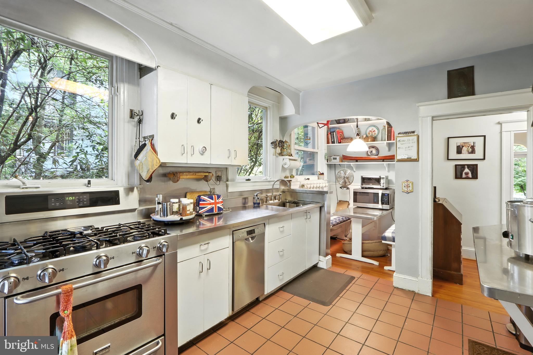 5721 Ridgedale Road Baltimore, MD 21209 - Photo 33 of 54 a kitchen with cabinets appliances and a window