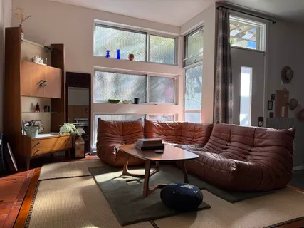 a living room with furniture and a large window