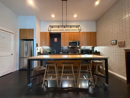 a kitchen with a sink cabinets and window