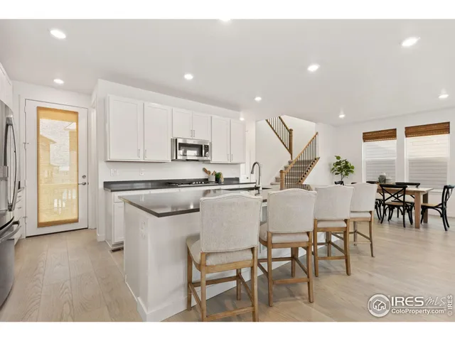 a view of kitchen with dining table and chairs