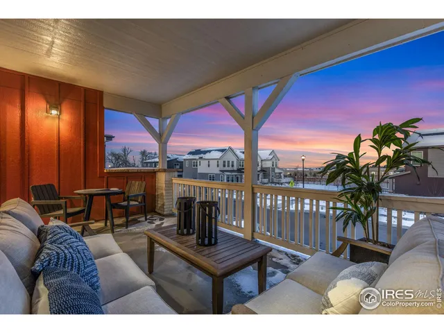 a living room with furniture a dining table and a potted plant