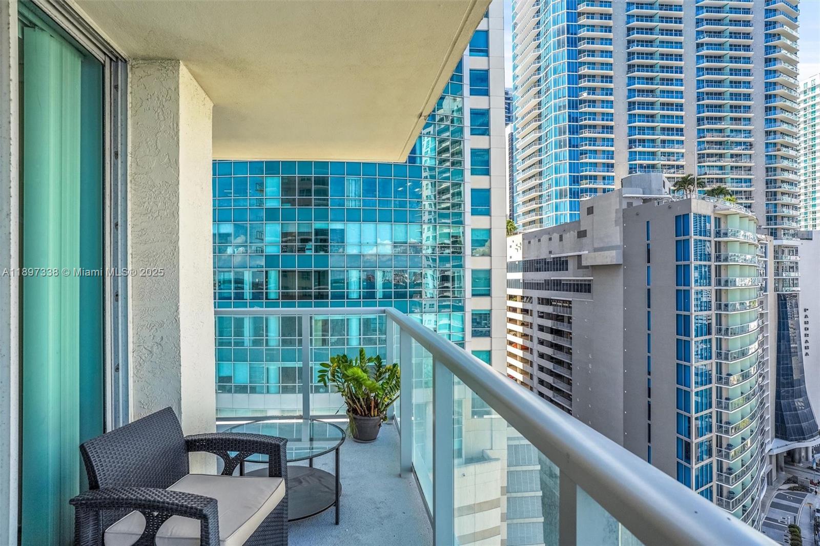 1155 Brickell Bay Drive, Unit 1702 Miami, FL 33131 - Photo 16 of 28 a balcony with a potted plant