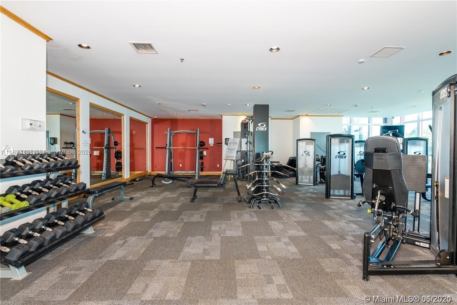 1155 Brickell Bay Drive, Unit 1702 Miami, FL 33131 - Photo 26 of 28 a view of a room with gym equipment