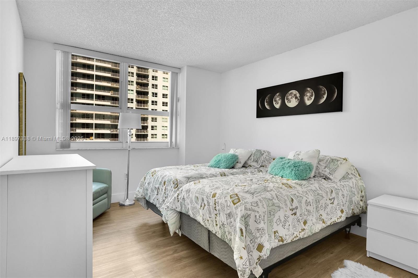 1155 Brickell Bay Drive, Unit 1702 Miami, FL 33131 - Photo 9 of 28 a bedroom with a bed and a window