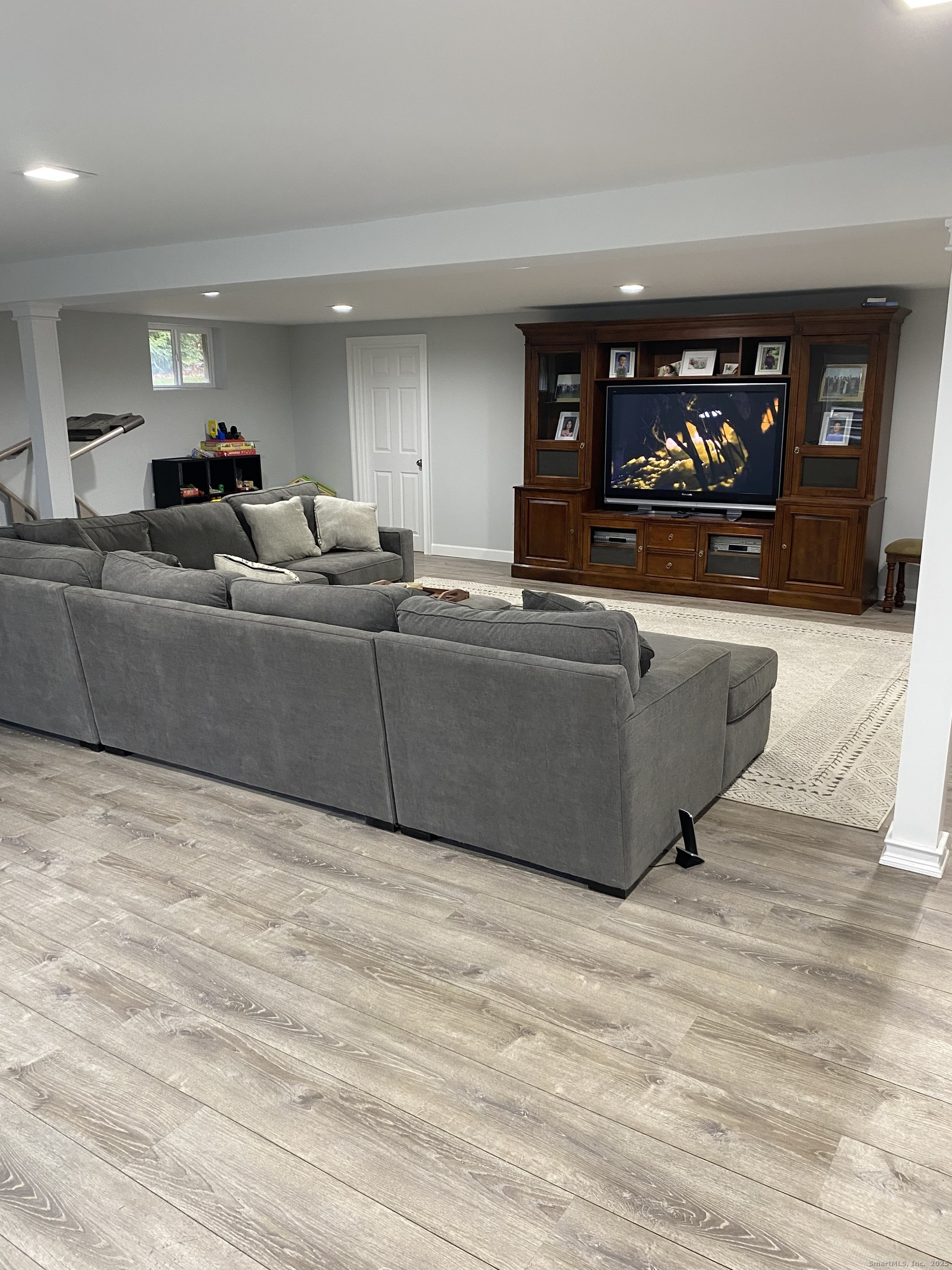 5 Meadow Wood Road Trumbull, CT 06611 - Photo 16 of 20 a living room with furniture and a flat screen tv