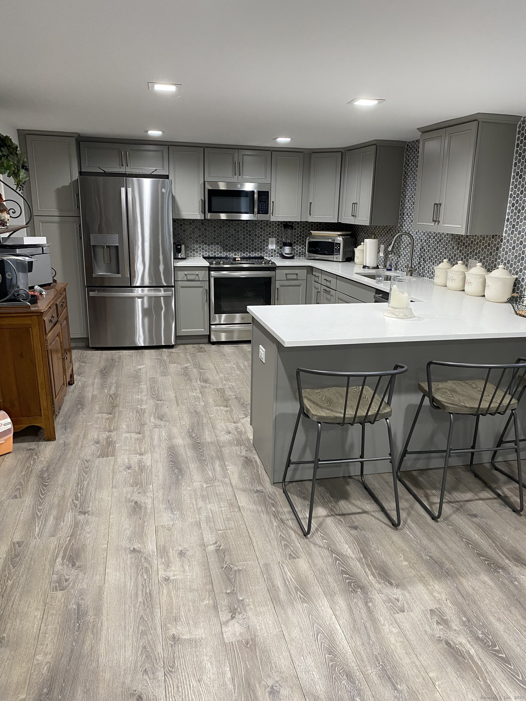 5 Meadow Wood Road Trumbull, CT 06611 - Photo 18 of 20 a kitchen with kitchen island a sink stove and refrigerator