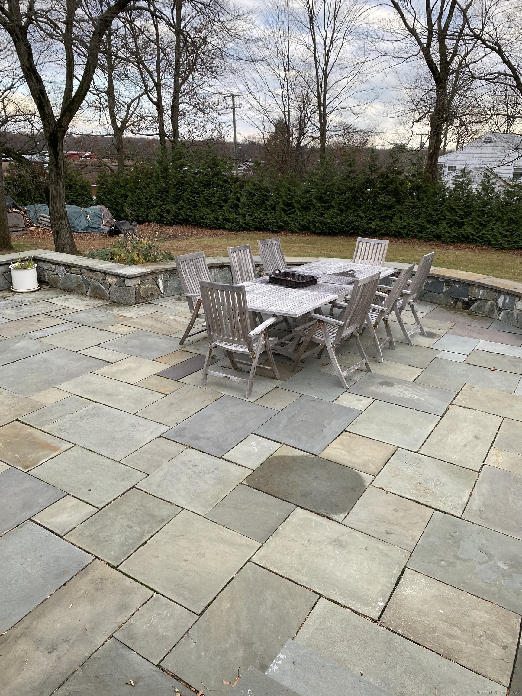 5 Meadow Wood Road Trumbull, CT 06611 - Photo 3 of 20 a view of a terrace with lawn chairs and couches