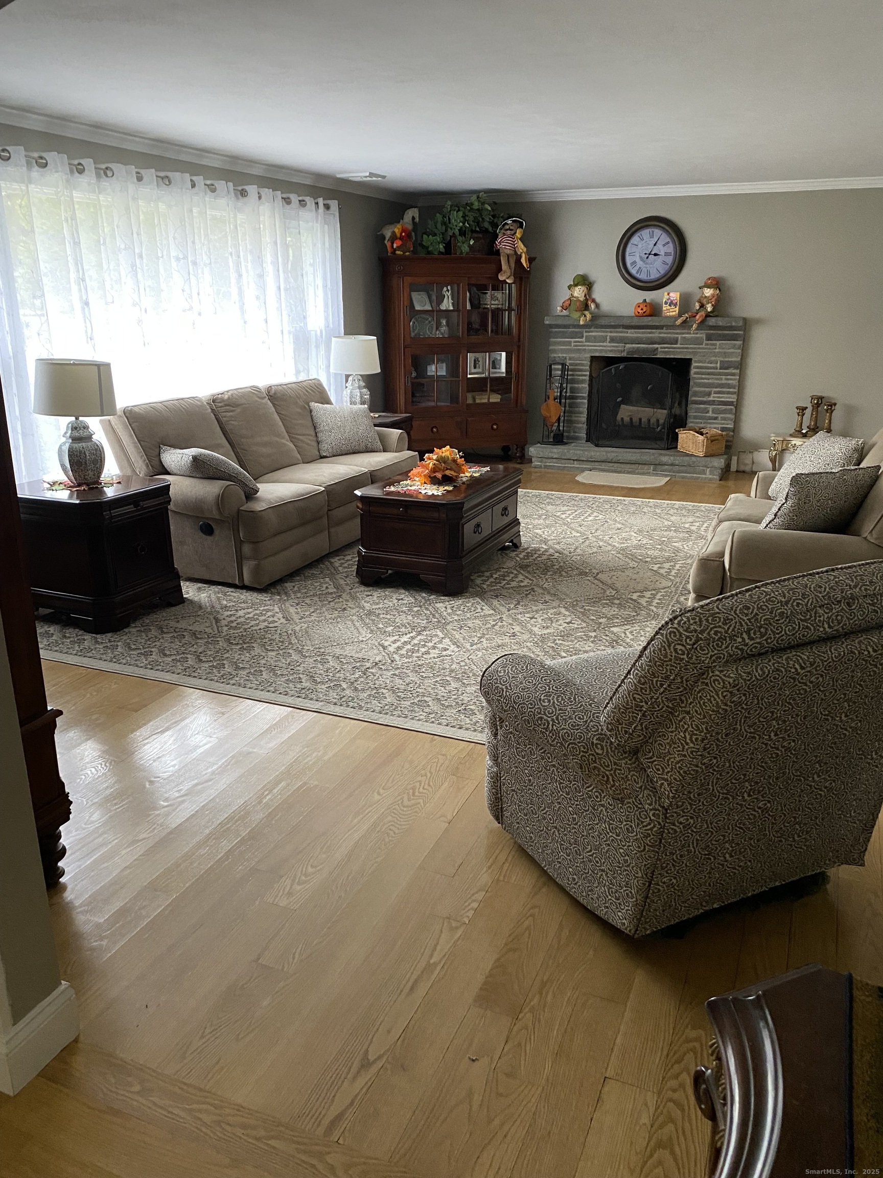 5 Meadow Wood Road Trumbull, CT 06611 - Photo 5 of 20 a living room with furniture window and fireplace