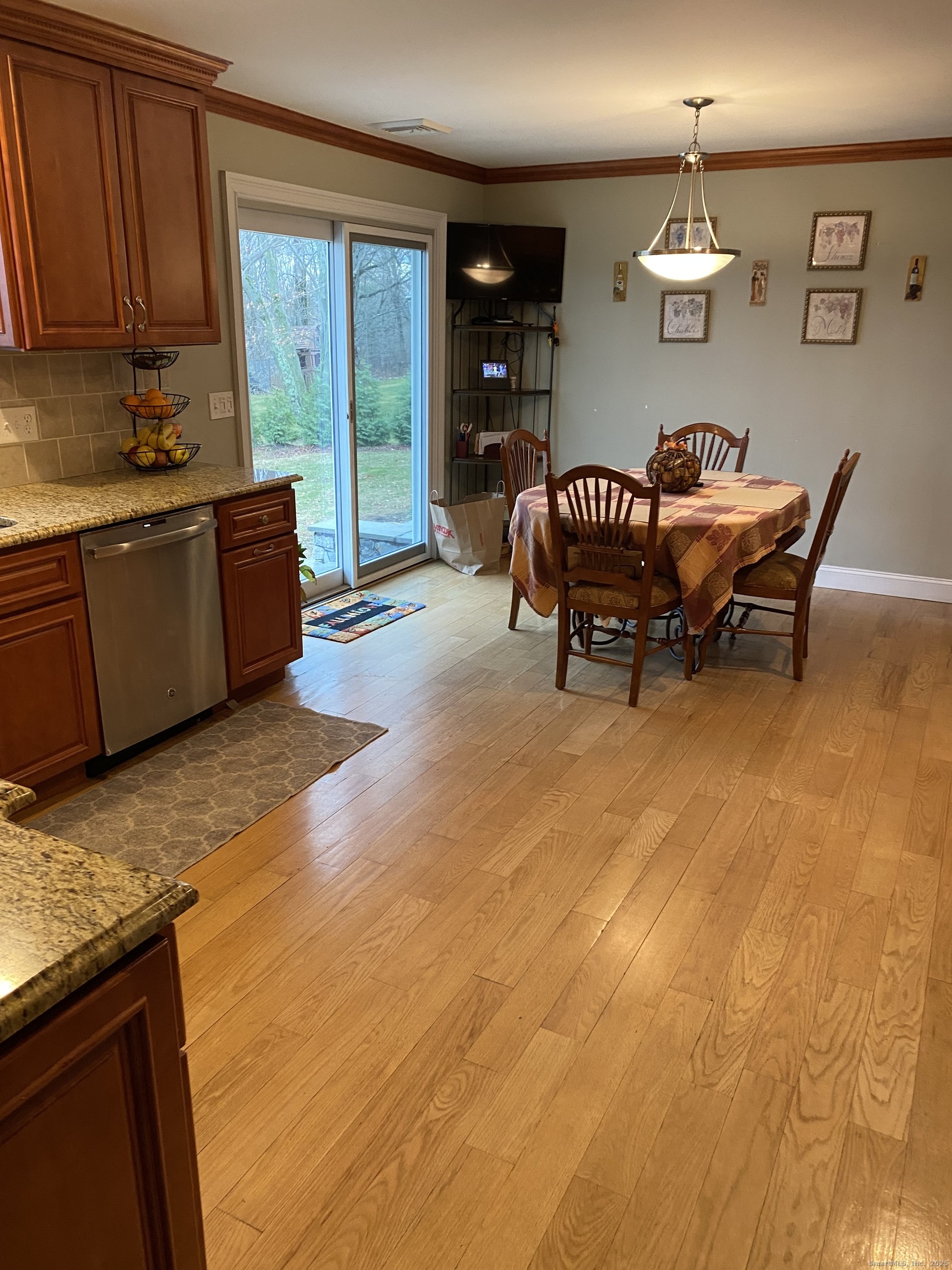 5 Meadow Wood Road Trumbull, CT 06611 - Photo 7 of 20 a spacious bedroom with a bed and a table in it