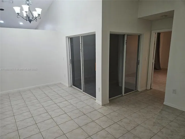 a kitchen with a sink a counter top space and stainless steel appliances