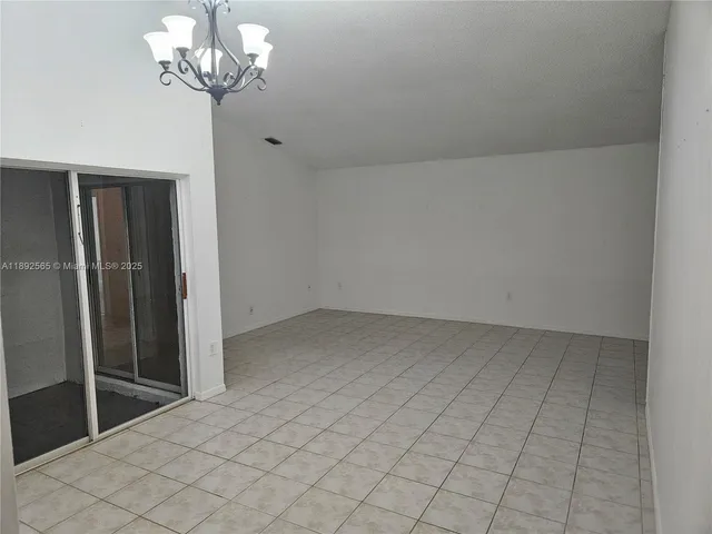 a kitchen with stainless steel appliances a refrigerator a stove a microwave and cabinets