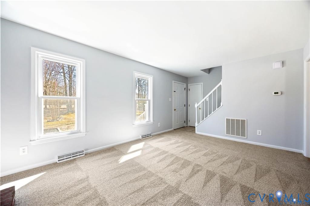 5062 Ruffin Road Prince George, VA 23875 - Photo 5 of 30 The family room with its new carpet and freshly pa