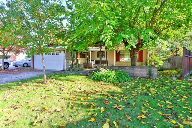 front view of a house with a yard