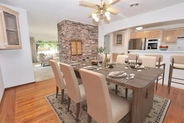 a view of a dining room with furniture window and wooden floor
