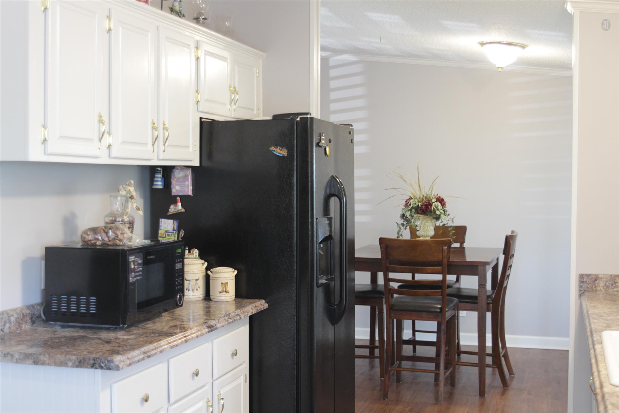 246 Coker Ford Road Portland, TN 37148 - Photo 14 of 19 a kitchen with stainless steel appliances granite countertop a refrigerator and a stove top oven