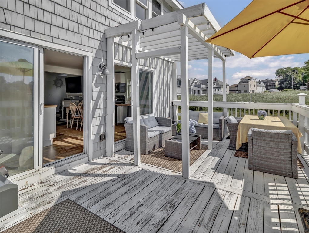 3 Bay View Street Hull, MA 02045 - Photo 17 of 39 a balcony view with a glass door