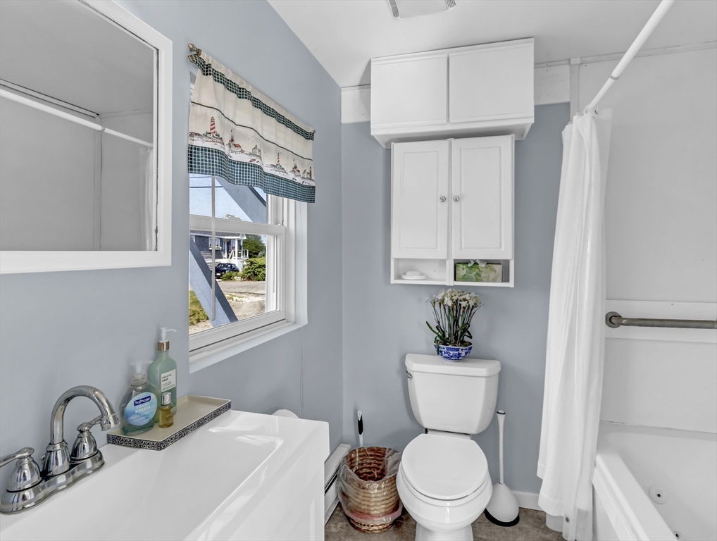 3 Bay View Street Hull, MA 02045 - Photo 20 of 39 a bathroom with a toilet a sink and a mirror