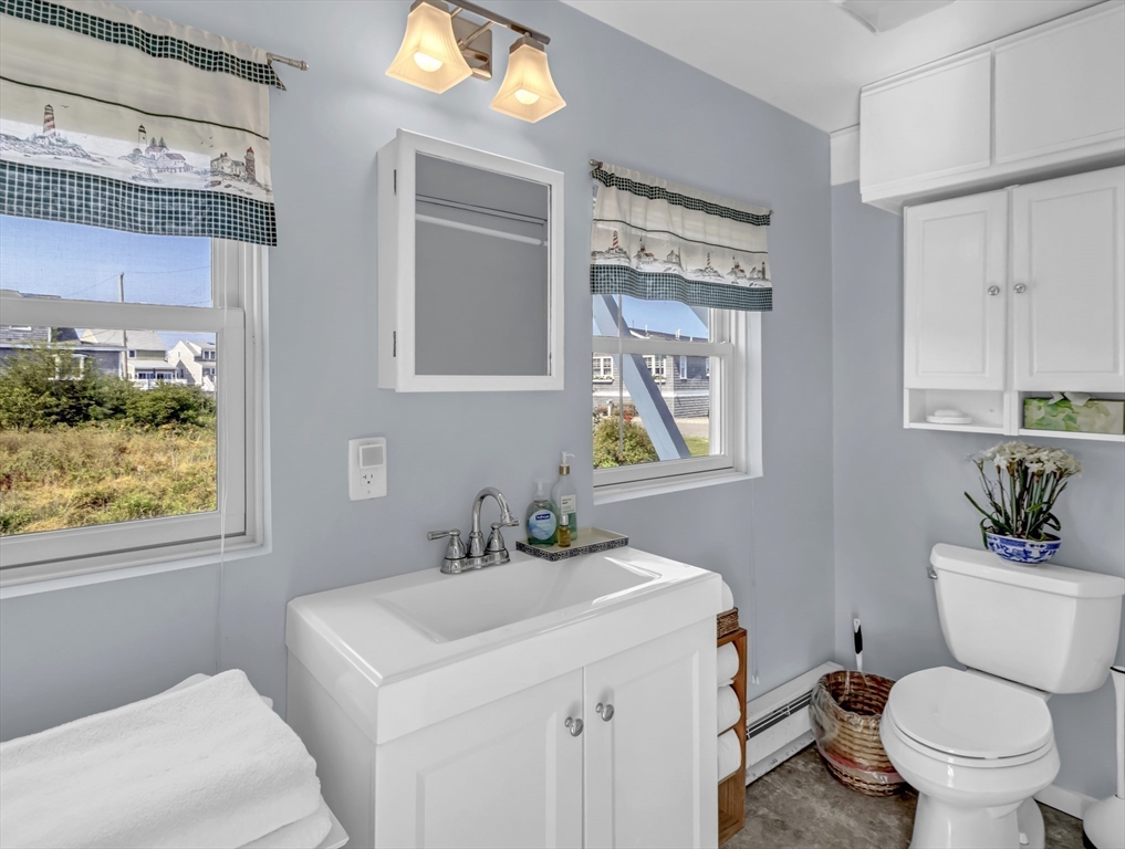 3 Bay View Street Hull, MA 02045 - Photo 21 of 39 a bathroom with a toilet sink and mirror
