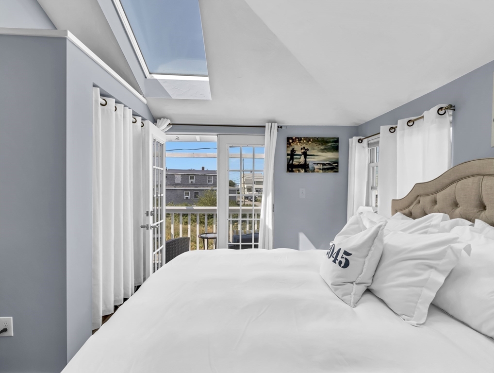 3 Bay View Street Hull, MA 02045 - Photo 26 of 39 a bedroom with a large bed and a window