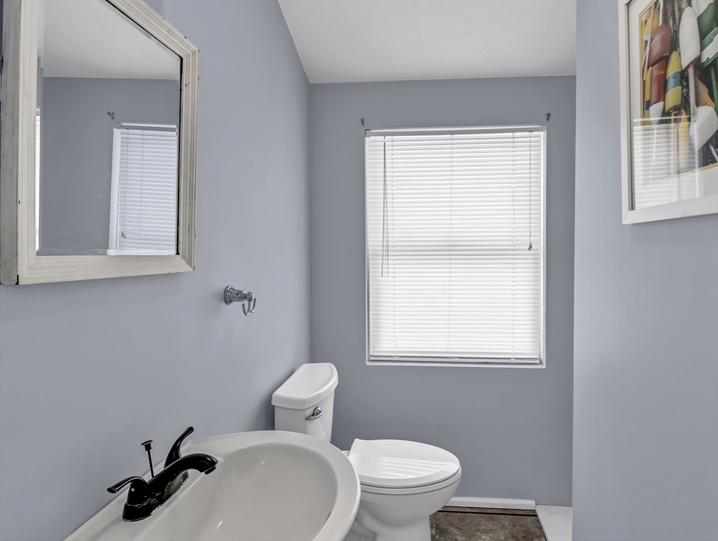 3 Bay View Street Hull, MA 02045 - Photo 30 of 39 a bathroom with a toilet a sink a window and mirror