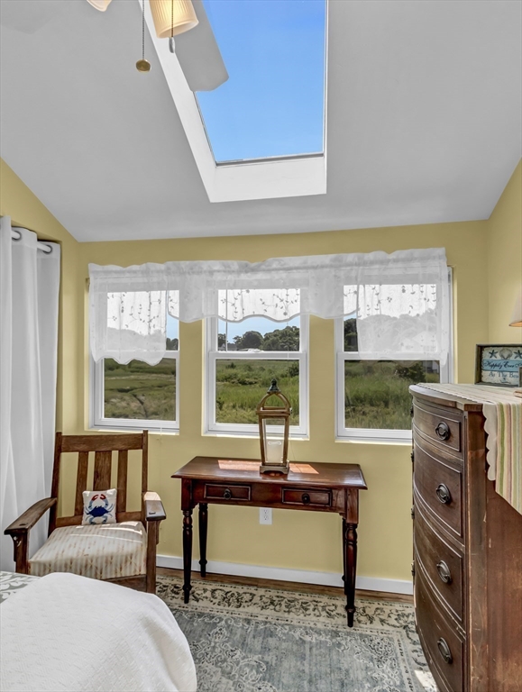 3 Bay View Street Hull, MA 02045 - Photo 33 of 39 a living room with furniture a large window and a flat screen tv