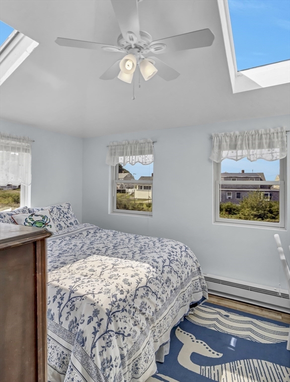 3 Bay View Street Hull, MA 02045 - Photo 35 of 39 a bedroom with a bed and a chandelier