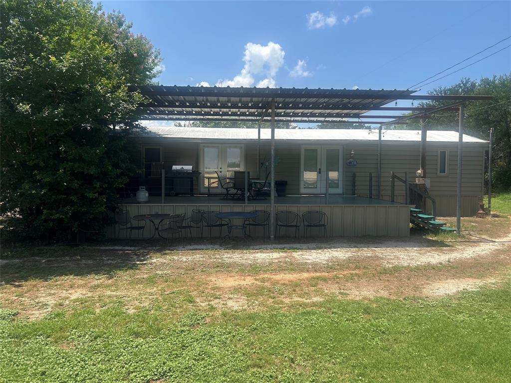 4705 Fox Hollow Road Graham, TX 76450 - Photo 2 of 28 Back of property with french doors and a yard