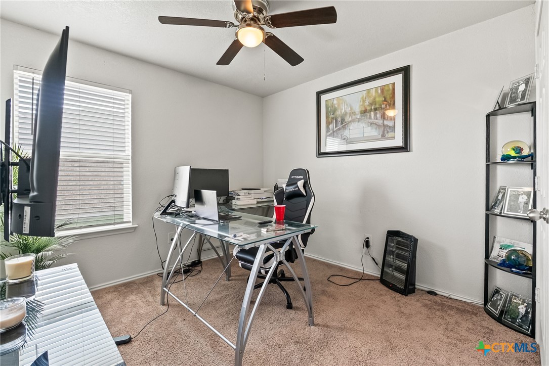 201 Danielle Drive Killeen, TX 76542 - Photo 4 of 16 a view of a workspace with furniture and a window