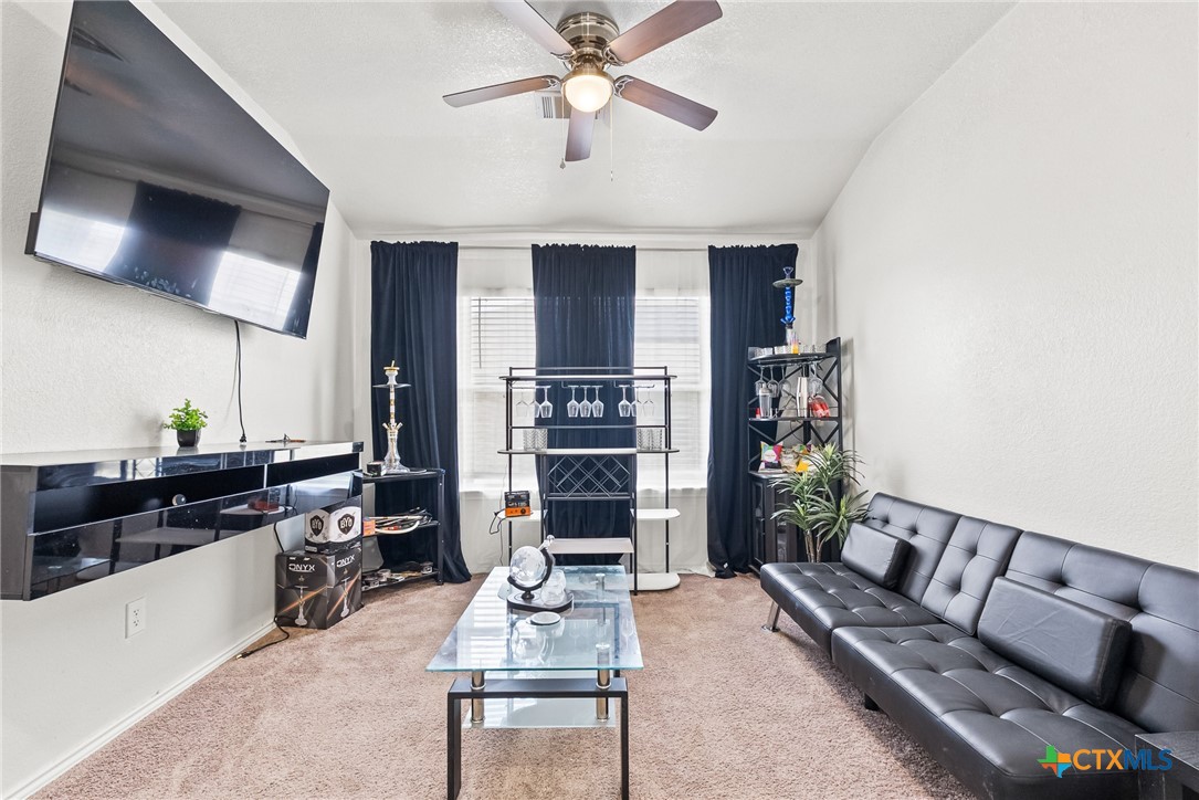 201 Danielle Drive Killeen, TX 76542 - Photo 5 of 16 a living room with furniture and a flat screen tv