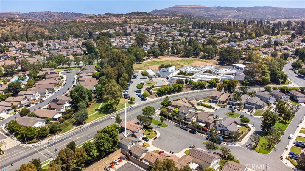 109 Cinnamon Ridge Road Brea, CA 92821 - Photo 62 of 67 Drone view of neighborhood and arrow of location of home.
