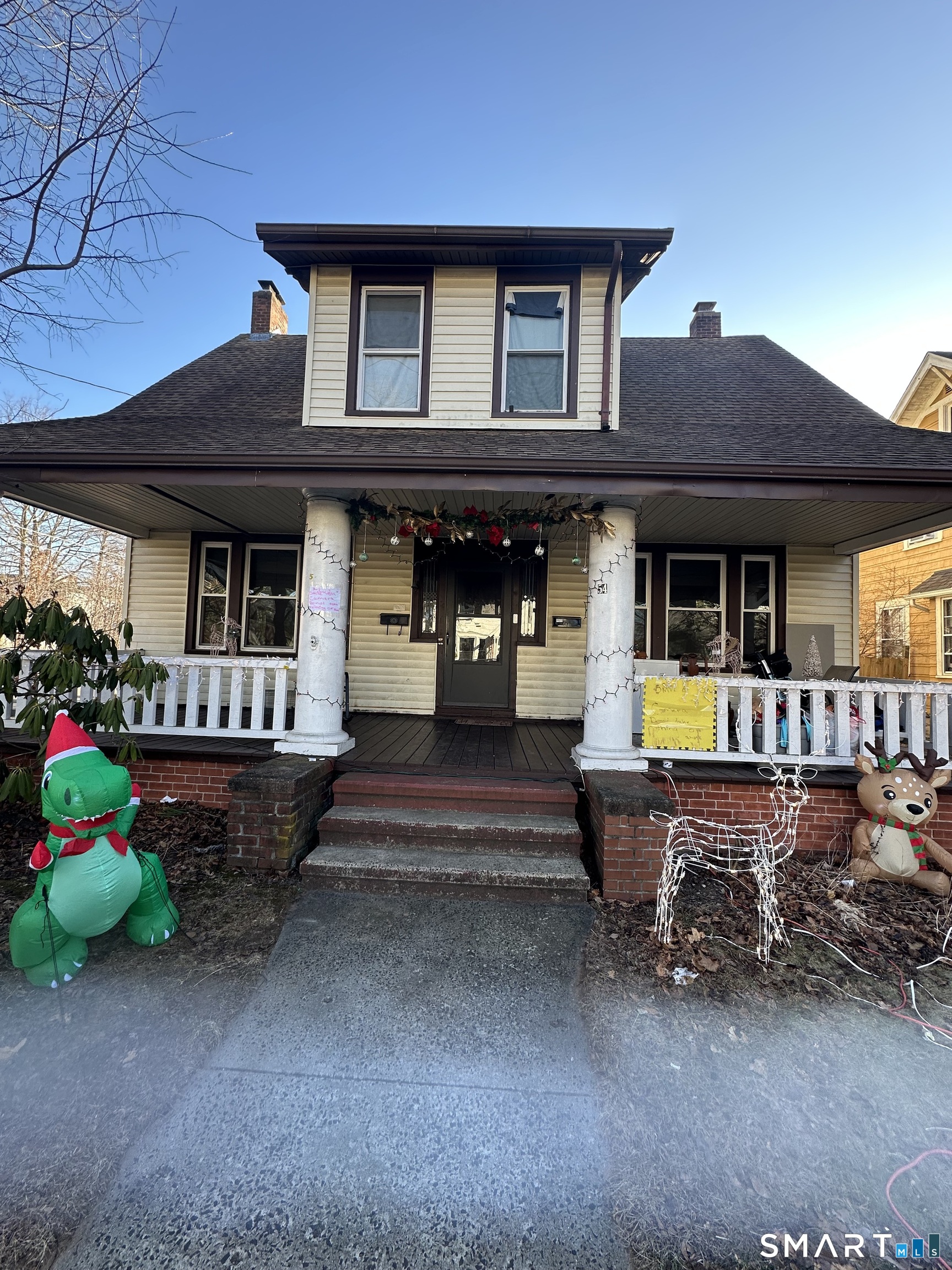 54 Ralston Avenue, Unit 1 Hamden, CT 06517 - Photo 2 of 16 a front view of a house with swimming pool