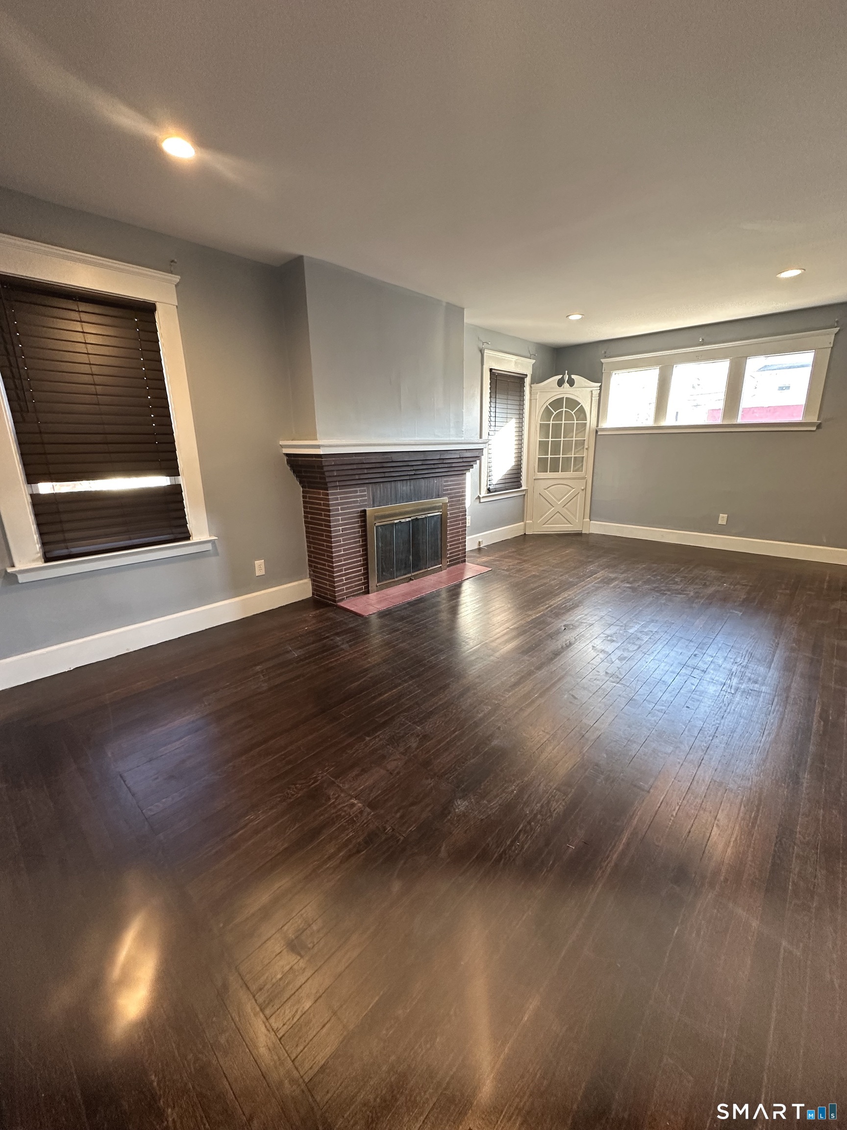 54 Ralston Avenue, Unit 1 Hamden, CT 06517 - Photo 4 of 16 a view of empty room with wooden floor and fan
